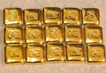 Giá vàng thế giới đi xuống trong phiên 7/9